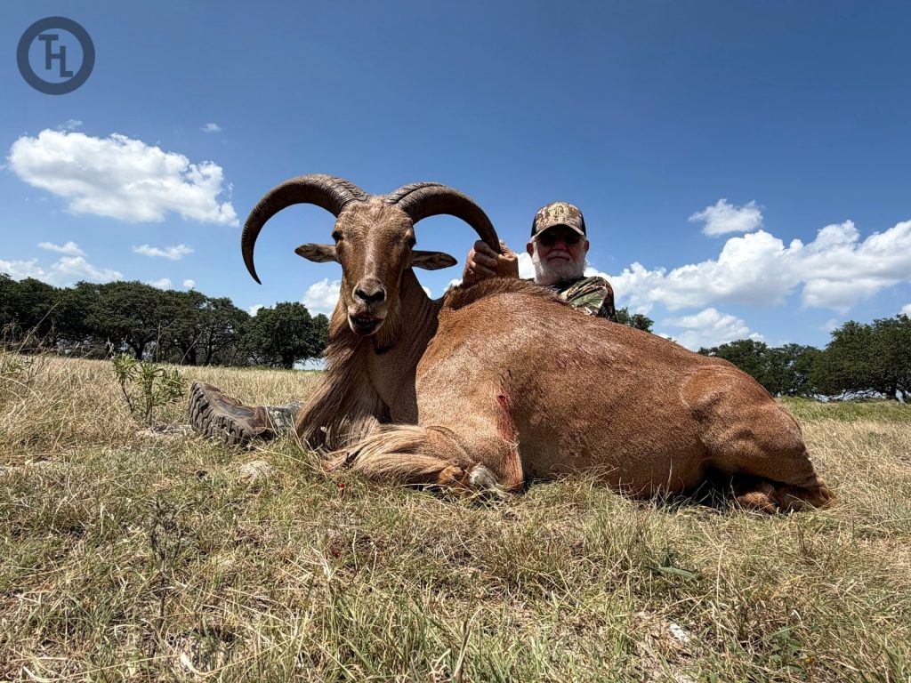 Hunter with a trophy Aoudad ram harvested at Texas Hunt Lodge in the Texas Hill Country