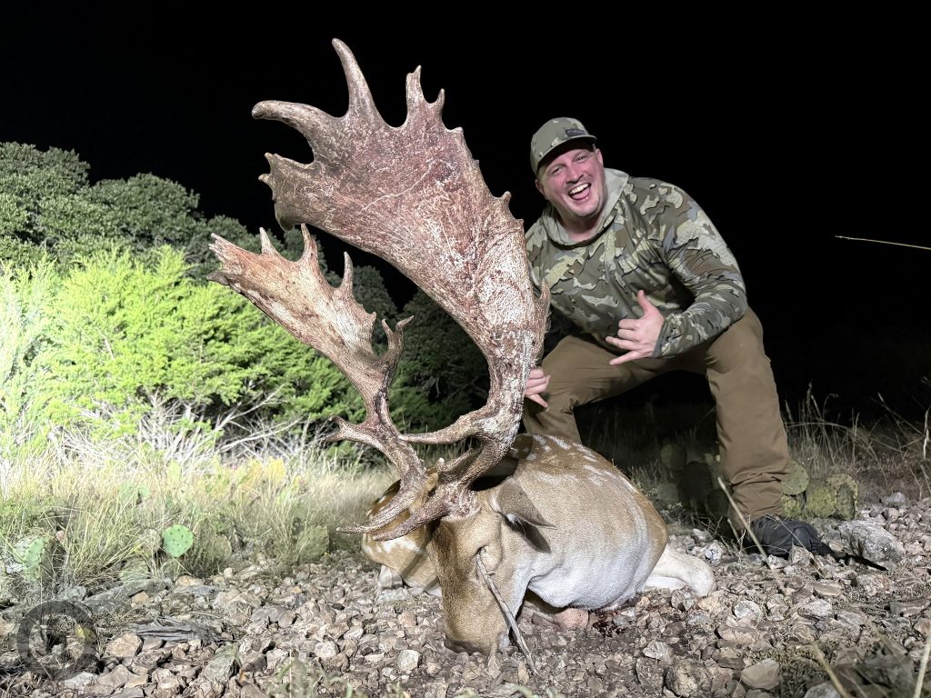 Hunter with a platinum class trophy Fallow deer harvested at Texas Hunt Lodge in the Texas Hill Country